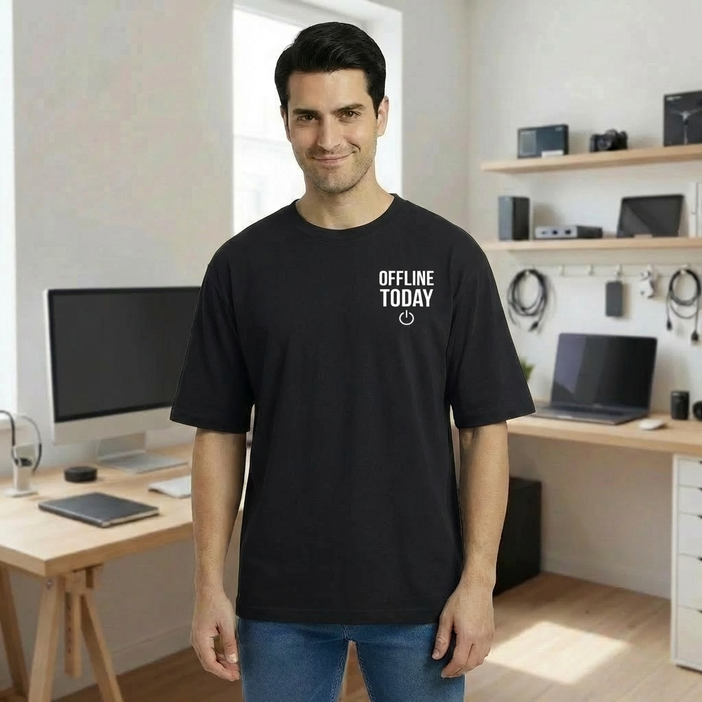Man wearing a black t-shirt with 'OFFLINE TODAY' text in a home office setting