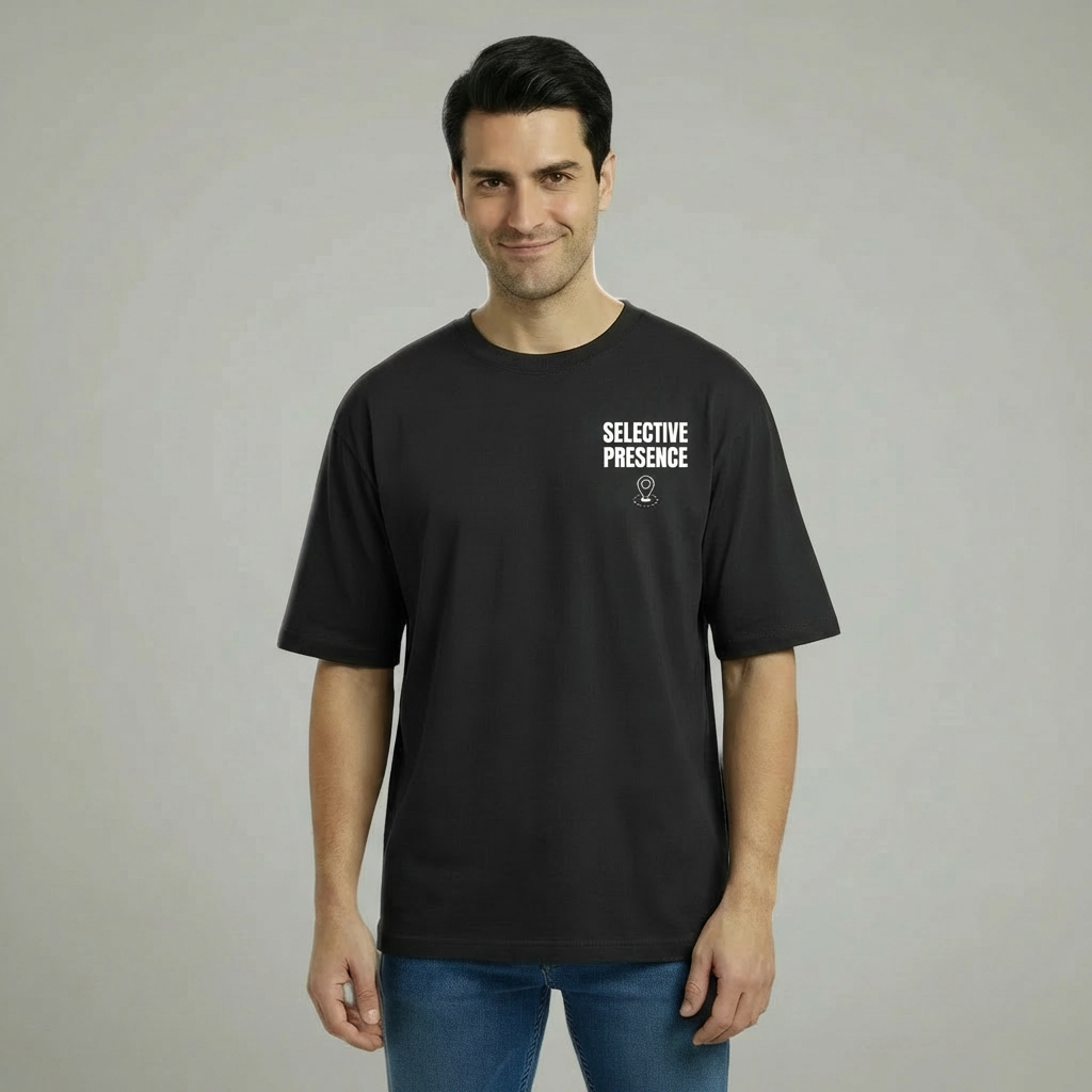 Man wearing a black t-shirt with 'SELECTIVE PRESENCE' text on a plain background