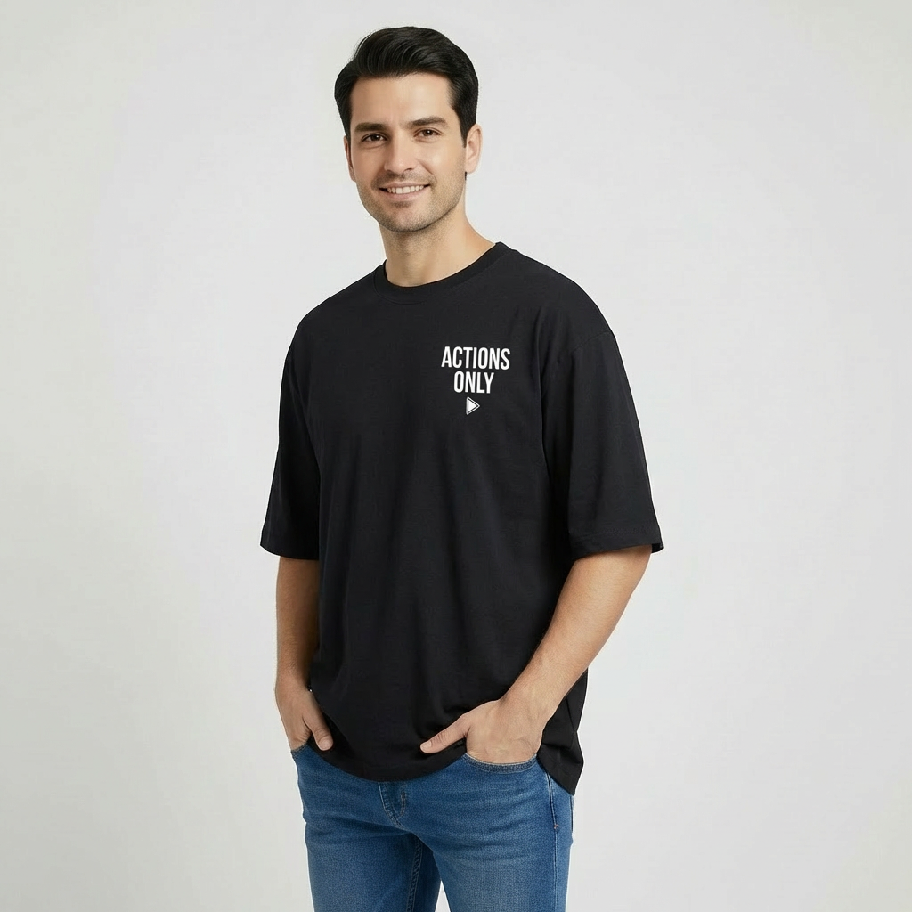 Man wearing a black t-shirt with ' ACTIONS ONLY' text on a plain background