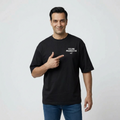 Man wearing black tee with words feeling producktive pointing towards it