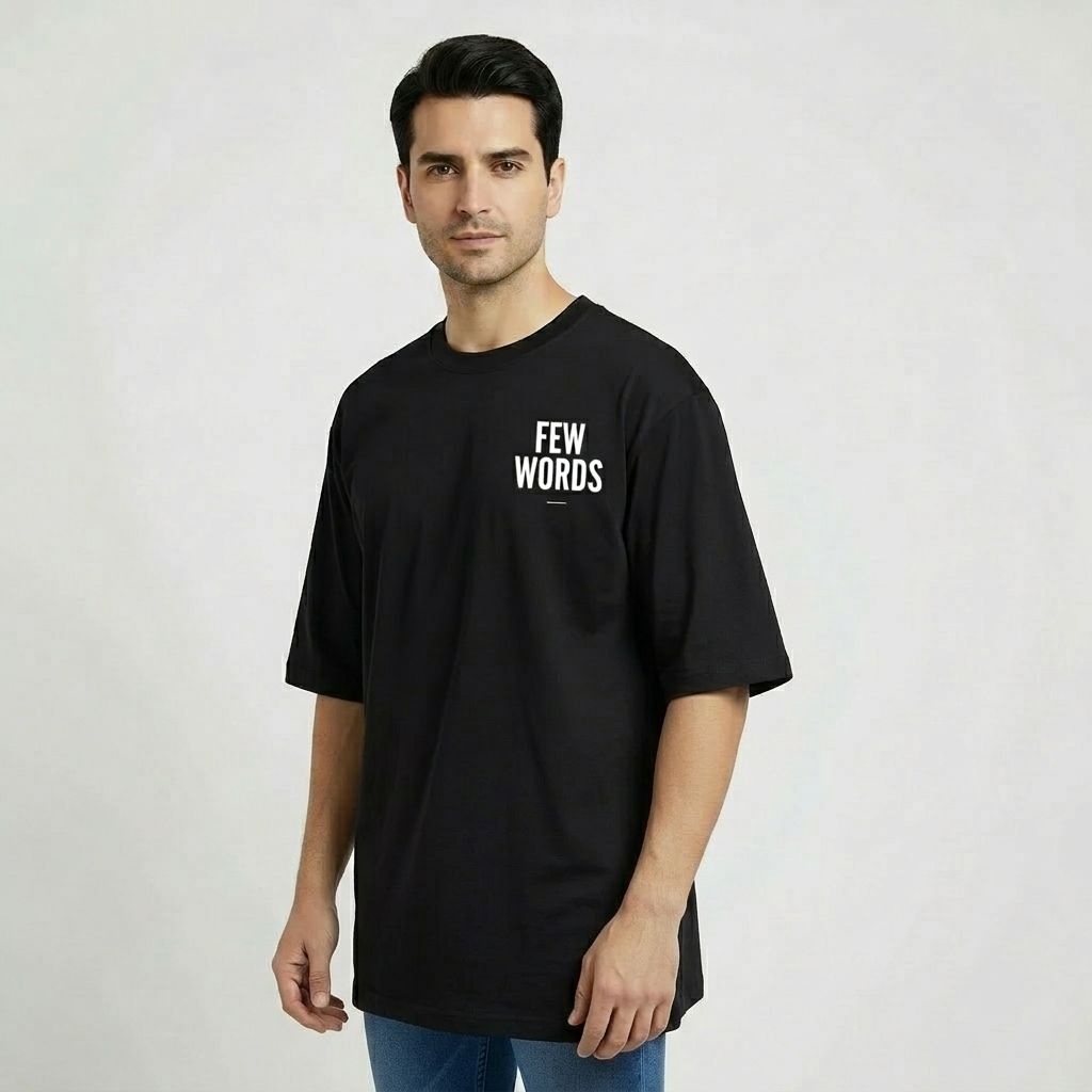 Man wearing a black t-shirt with 'FEW WORDS' text on a plain background