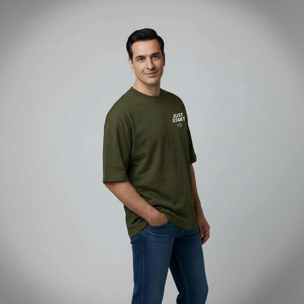 Man wearing a green t-shirt with text on a plain background